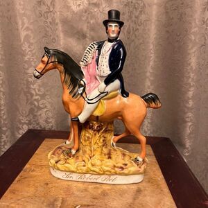 A STAFFORDSHIRE POTTERY EQUESTRIAN FIGURE OF SIR ROBERT PEEL
